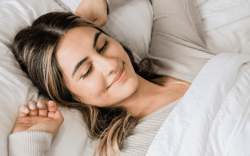 Woman with great sleep quality waking up.